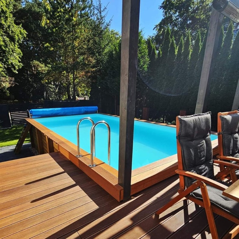 Zwembad AQUA 6.1 x 2.85 – H.1.31 m, grijs, met beugels vastgeschroefd aan beton
